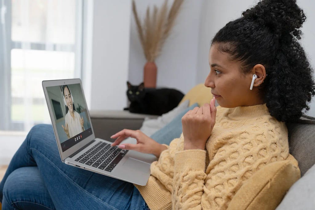 woman with an open laptop on her lap