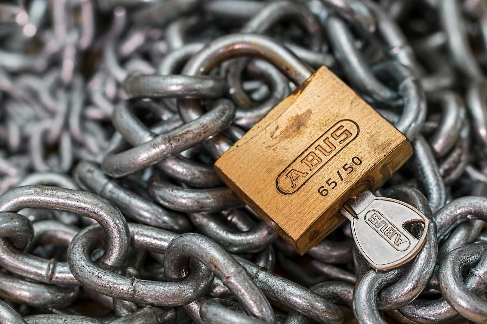 Padlock and chain symbolising feeling trapped in a difficult adult child parent relationship. adult child relationship conflict between parent and adult child