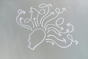 The Rewind technique for trauma – abstract image symbolising overwhelm easing into clarityhead outline with curly arrows coming from it