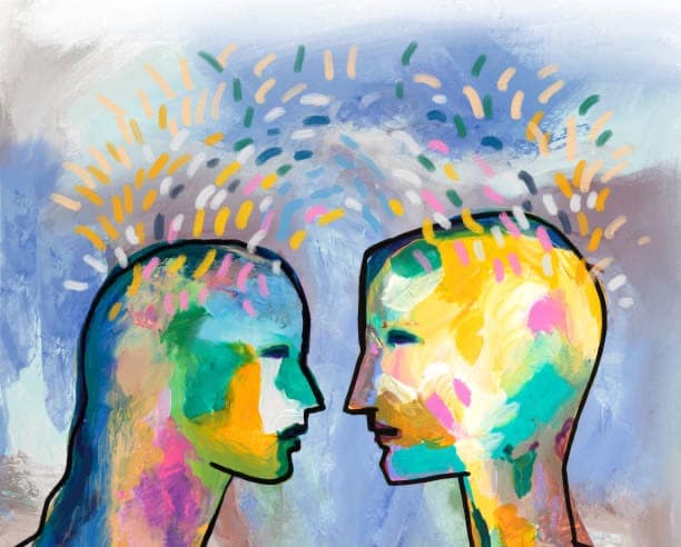 Abstract colourful faces representing communication in relationships and emotional connection